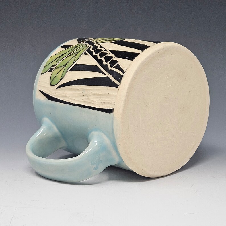 Handcrafted Sgraffito Dragonfly Mug with Blue and Green Wings -  Light Blue Glaze