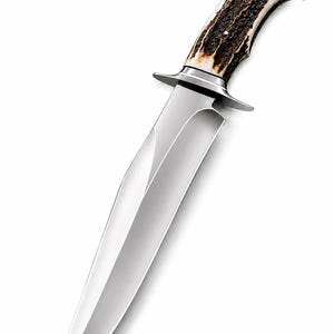 May include: A large, polished hunting knife with a wide, silver blade. The handle is made of textured brown and cream-colored material, possibly antler. A silver guard separates the blade and handle.