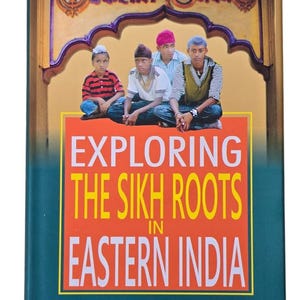 May include: A book titled Exploring the Sikh Roots in Eastern India by Jagmohan Singh Gill. The cover features a photograph of four individuals wearing turbans sitting in front of an arched structure with text in a script above them.