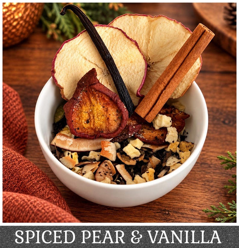 May include: A white bowl filled with loose leaf tea, dried apple slices, a dark vanilla bean, and a cinnamon stick. The tea blend contains small pieces of dried fruit and coconut. The text SPICED PEAR & VANILLA is printed at the bottom.