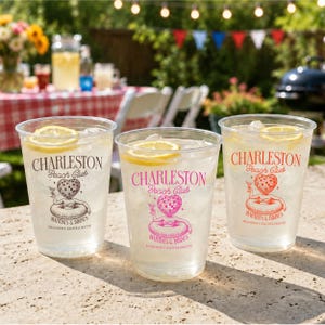 May include: Three clear plastic cups filled with ice, a lemon slice, and a beverage. Each cup features the text Charleston Beach Club, a disco ball-headed figure in a pool float, and the text Martinis & Bikinis Shannen's Bachelorette.