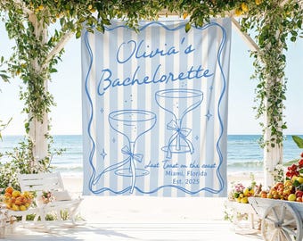 Pode incluir: Um fundo listrado azul claro e branco com o texto "Olivia's Bachelorette" e duas taças de champanhe. O fundo também inclui o texto "Last Toast on the coast Miami, Florida Est. 2025".