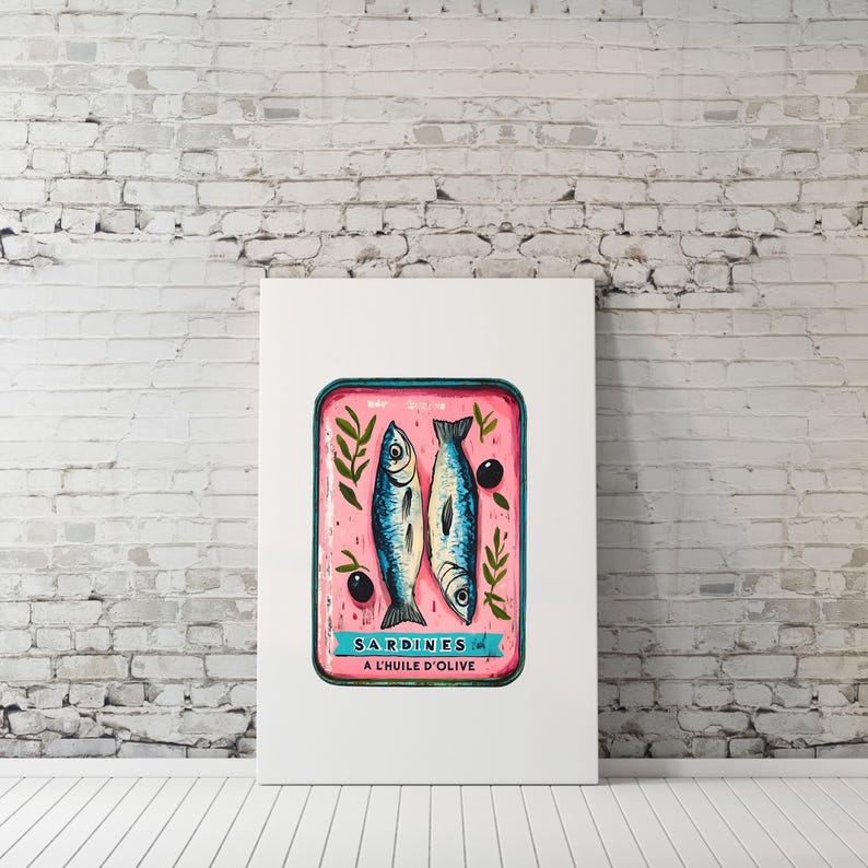 May include: A vintage-style illustration of a can of sardines in olive oil. The can is pink with blue trim and features two sardines, olive branches, and black olives. The text on the can reads "SARDINES A L'HUILE D'OLIVE".