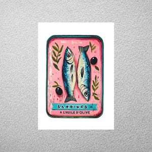 May include: A vintage-style illustration of a tin of sardines in olive oil. The tin is pink with blue trim and features the text "SARDINES A L'HUILE D'OLIVE". Two sardines are depicted inside the tin, swimming in olive oil.