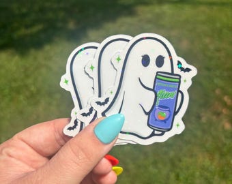 May include: A stack of three white ghost stickers with a holographic finish. Each ghost holds a can of "Witch's Brew" with a green cauldron and orange fruit. Black bat and green star accents complete the design.