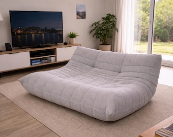 Sofá de suelo beige de perfil bajo, sofá lounge capitoné, silla de suelo minimalista, sofá moderno para sala de estar, decoración neutra para el hogar