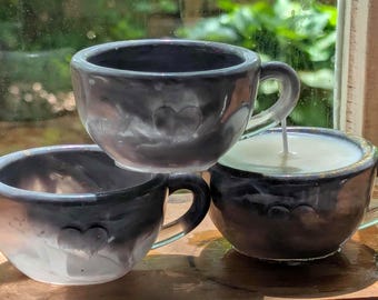 Thunderstorm in a Teacup Candle -wet pavement (petrichor), rain water, ferns, and flowers in a gray, swirly, handmade resin tea cup.