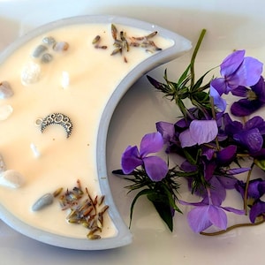 Lavender Moon Candle : Lavender, white birch, and moonlight scented, in a handmade resin moon. Hand poured and adorn with crystals and charm