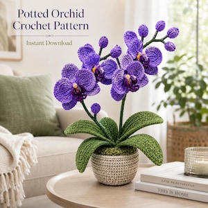 May include: A crocheted purple orchid plant in a beige pot. The orchid has detailed petals and green leaves. The text "Potted Orchid Crochet Pattern" and "Instant Download" are visible in the image.
