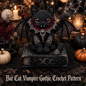 May include: A black crocheted cat with bat wings, red eyes, and white fangs, wearing a red and black ruffled collar with a red gemstone pendant. The cat sits on a black book featuring moon phase symbols and the text Bat Cat Vampire Gothic Crochet Pattern.