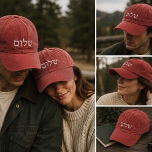 May include: A red baseball cap featuring the Hebrew word Shalom embroidered in white thread on the front panel. The cap has a curved brim, a structured crown, and an adjustable strap at the back, showcasing a classic six-panel design.
