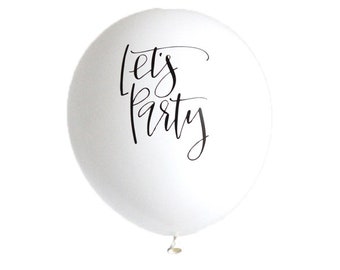 May include: White balloon with black calligraphy that reads "Let's Party".