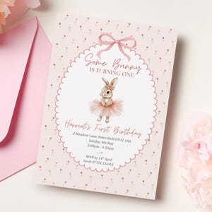 May include: A pink invitation card with the text "Some Bunny is Turning One" and "Harriet's First Birthday." The card features a watercolor illustration of a bunny wearing a tutu. A pink envelope and flowers are in the background.