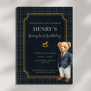 May include: A birthday invitation for Henry, featuring a teddy bear illustration in a suit. The design includes a navy blue background with a gold border and plaid pattern. The invitation includes the date, time, and RSVP details. The text reads 'beary first birthday'.