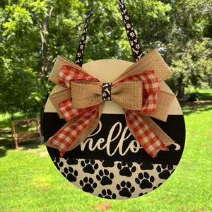 Appendino da porta con impronta di zampa