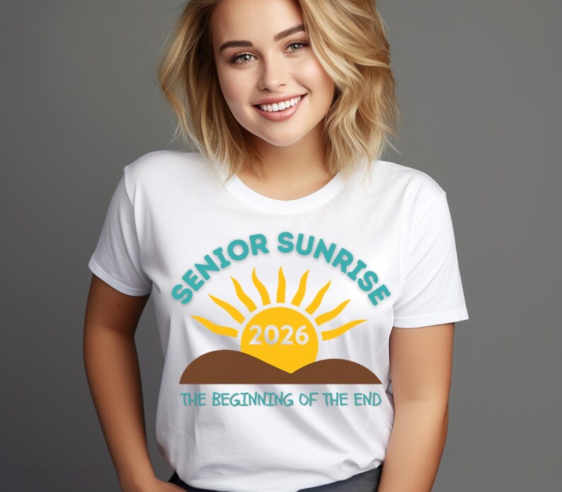 May include: White t-shirt with the words "SENIOR SUNRISE" in teal, a yellow sun graphic, and the year "2026" in yellow. Below the sun is a brown hill graphic and the text "THE BEGINNING OF THE END" in teal.