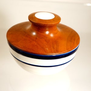 Pottery bowl with wooden lid. Covered bowl.