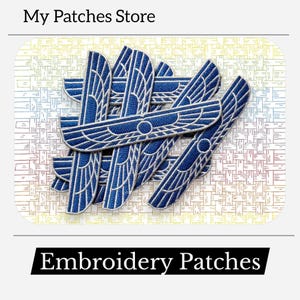 May include: A collection of blue and white embroidered patches with a wing-like design. The patches are arranged on a patterned background. The text "My Patches Store" and "Embroidery Patches" are displayed.