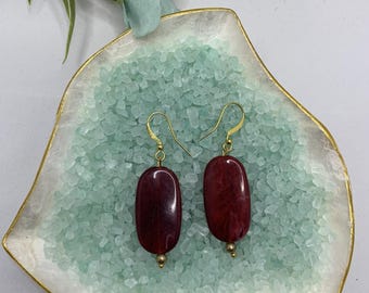 Long red oval drop and dangle earrings