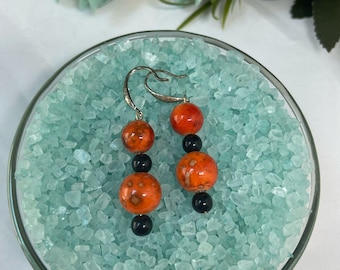 Orange and black dangle and drop earrings