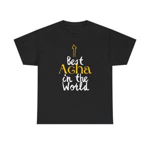 May include: Black t-shirt with white text that reads "Best Acha in the World" with a yellow arrow pointing upwards.
