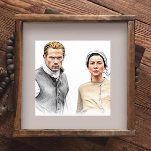 May include: A square framed print featuring a detailed sketch of two individuals. On the left, a person with reddish-blonde hair wears a dark vest and white cravat. On the right, a person with dark hair wears a light-colored cap and buttoned top.