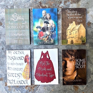 May include: Six rectangular wooden plaques featuring Outlander-themed designs. The prints include quotes, character portraits, a stone castle, and a red dress illustration. The text includes phrases like Sing me a song, My other husband, and Some like it Scot.