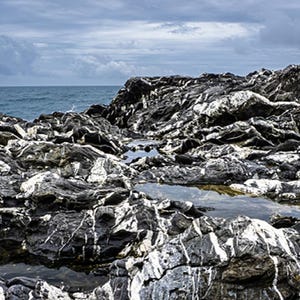 Beach rocks and sea with cloudy sky, fine art photography print, color print, color photo, wall decor, unframed print, landscape photography