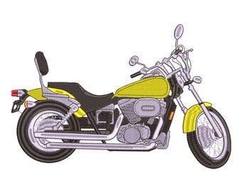 May include: Embroidered design of a yellow and black motorcycle. The motorcycle has a black seat, a yellow petrol tank and mudguards, and chrome exhaust pipes. The design is on a white background.