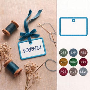 May include: A rectangular white tag with a blue border and the name SOPHIA in blue text, attached to a blue velvet ribbon bow. Two wooden spools of blue thread, a sewing needle, and dried flowers are present, alongside a digital file format list.