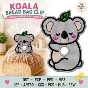 Op de afbeelding: Een machineborduurontwerp voor een koala broodzakclip. De koala is grijs met roze wangen, een zwarte neus en een groen blaadje op het hoofd. Het ontwerp heeft een cirkelvormige uitsparing in het midden van het lichaam.