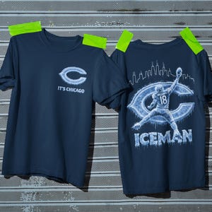 May include: Two navy blue t-shirts. One features the Chicago Bears logo with "IT'S CHICAGO" text. The other shirt displays a football player graphic with the text "ICEMAN" and the Chicago skyline.