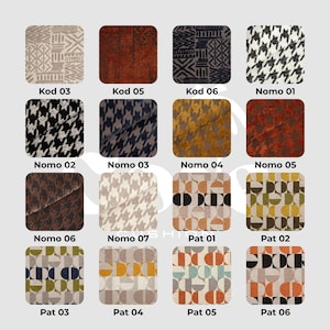May include: A collection of fabric swatches with various patterns and colors. The swatches include geometric, houndstooth, and abstract designs. Each swatch is labeled with a code, such as "Kod 03" and "Nomo 01". The color palette includes beige, brown, black, and gold.
