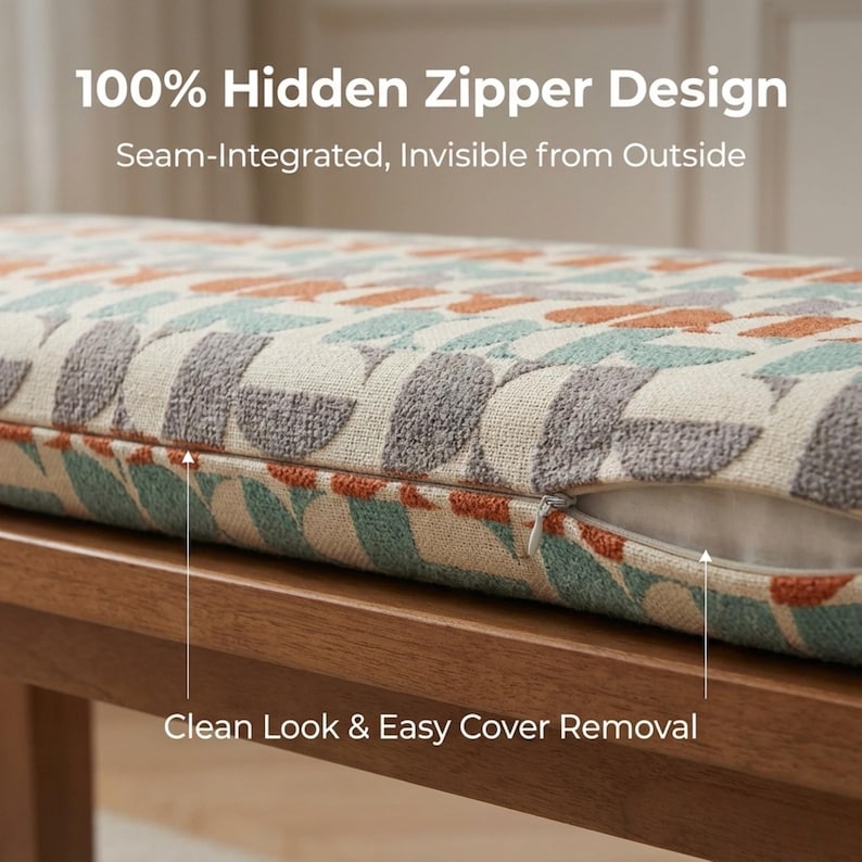 May include: Close-up of a bench cushion with a hidden zipper design. The cushion features a geometric pattern in shades of gray, teal, and orange on a cream background. The text reads "100% Hidden Zipper Design" and "Clean Look & Easy Cover Removal."