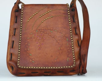 Beautiful vintage handmade, hand tooled, studded boho leather hippie hand shoulder bag.