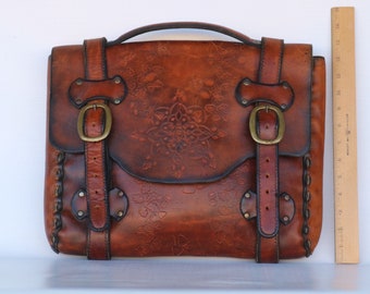 Vintage large hand tooled leather satchel.