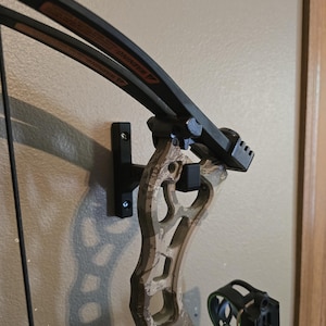 Wall mount bow hanger