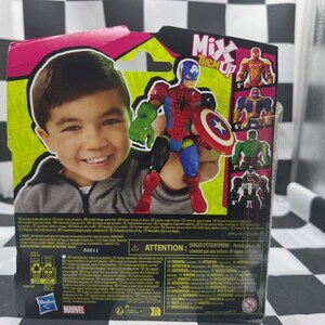 May include: Action figure packaging featuring a smiling child and a superhero toy. The toy is a combination of Captain America, Spider-Man, and Hulk. The packaging has the words "Mix 'em Up" and other superhero figures.