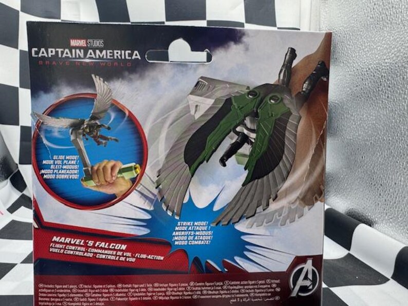 May include: Marvel's Falcon action figure from Captain America: Brave New World. The packaging features a graphic of the Falcon in flight, with green and gray wings. The packaging also includes text in multiple languages.