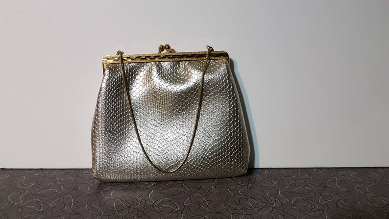 silver snakeskin clutch bag