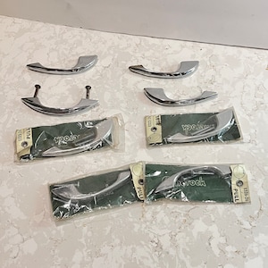 May include: Eight chrome cabinet pulls in individual packaging. Each pull is labelled "Norrock Pull" with a model number.