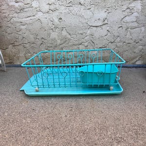 May include: A turquoise blue metal dish rack with a matching tray. The dish rack has a wire design and a small, separate compartment for utensils.