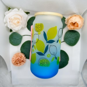 Sip in style with this vibrant 16 oz frosted glass tumbler featuring a fun lemon and citrus design. Perfect for iced tea, lemonade, smoothie