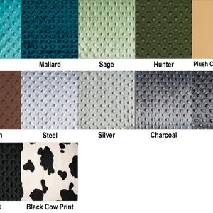 May include: A collection of fabric swatches in various colors and patterns. Colors include teal, mallard, sage, hunter, camel, brown, steel, silver, charcoal, ash, and black. One swatch features a black and white cow print.