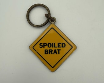 Vintage SPOILED BRAT Metal Keychain Yellow Road Sign Key Fob