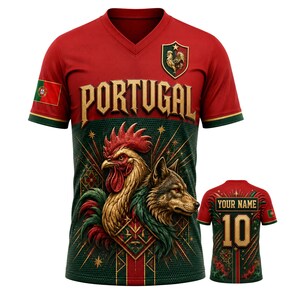 May include: A red and green V-neck jersey featuring the word PORTUGAL in gold lettering, a rooster crest, and a graphic of a rooster and wolf. The back displays the text YOUR NAME and the number 10 in gold, with a small Portuguese flag on the sleeve.