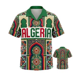 May include: Short-sleeved button-up shirt with a vibrant, geometric pattern in green, red, and gold, featuring the word "ALGERIA" in bold white letters. The shirt has a green collar and a matching design on the back.