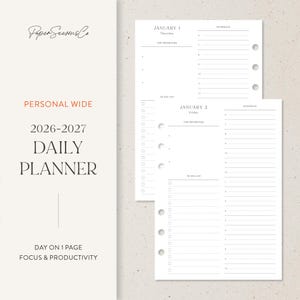 May include: A white daily planner insert with the text "Personal Wide 2026-2027 Daily Planner." The insert includes sections for top priorities, to-do lists, and schedules. The planner is designed for focus and productivity.