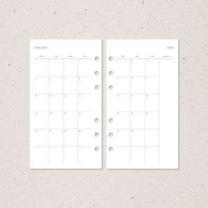 May include: Two-page spread of a minimalist planner insert. The left page is labeled "JANUARY" and displays a monthly calendar grid. The right page is labeled "2026" and also shows a monthly calendar grid. Both pages are white with black grid lines.
