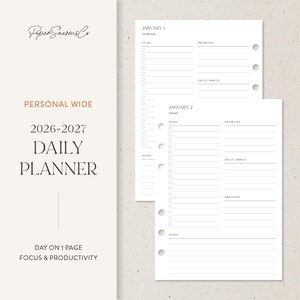 May include: A white daily planner with the text "PERSONAL WIDE 2026-2027 DAILY PLANNER" and "DAY ON 1 PAGE FOCUS & PRODUCTIVITY". The planner pages include sections for to-do lists, priorities, calls/emails, and notes. The planner is designed for focus and productivity.
